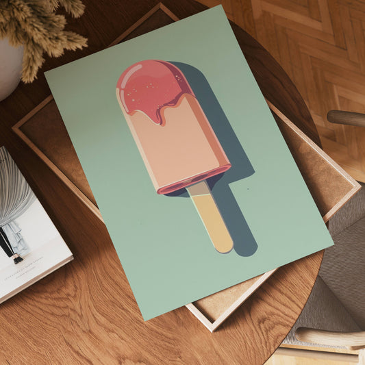 The no-9 green poster, featuring a vibrant popsicle with pink topping, rests on a wooden table beside a book and tray in a warmly lit room with herringbone wood flooring.