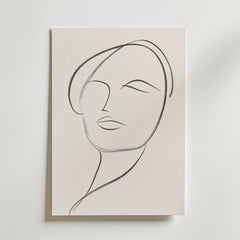 Bozetto's Minimalist Female Portrait Poster visar en modern linjeteckning av en kvinnas ansikte i enkla svarta streck på premiumpapper, med ögon, läppar och en lätt huvudlutning mot en ljus bakgrund.