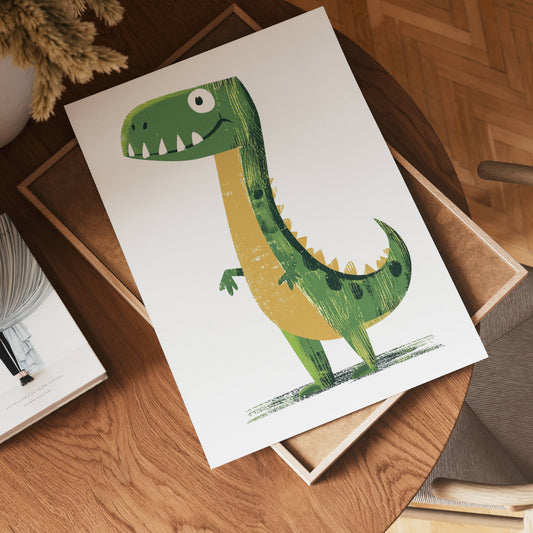 A cheerful green cartoon dinosaur with yellow accents is printed on no-9 white paper, displayed on a wooden table beside a book and chair.