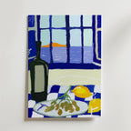 Sea Breeze Still Life Poster by Bozetto föreställer en livfull medelhavsinspirerad scen med en vinflaska, druvor och citroner på en rutig duk, inramad av en havsutsikt i solnedgång - perfekt för att lysa upp vilket utrymme som helst.