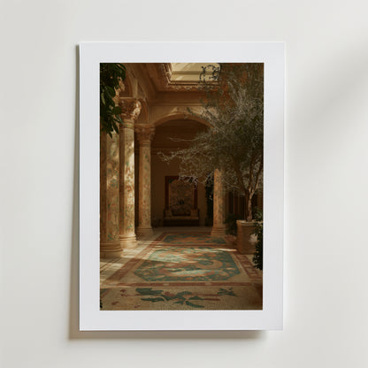 Mediterranean Courtyard Poster by Bozetto visar ett elegant inomhusrum med utsmyckade pelare och frodiga växter, tryckt på FSC-certifierat premiumpapper för en högkvalitativ finish och placerad mot en ljus vägg.