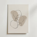 Linear Harmony Poster by Bozetto har minimalistisk abstrakt konst med två mjuka beige former och tre överlappande svarta linjeslingor, tryckt på premiumpapper för en lyxig matt finish.