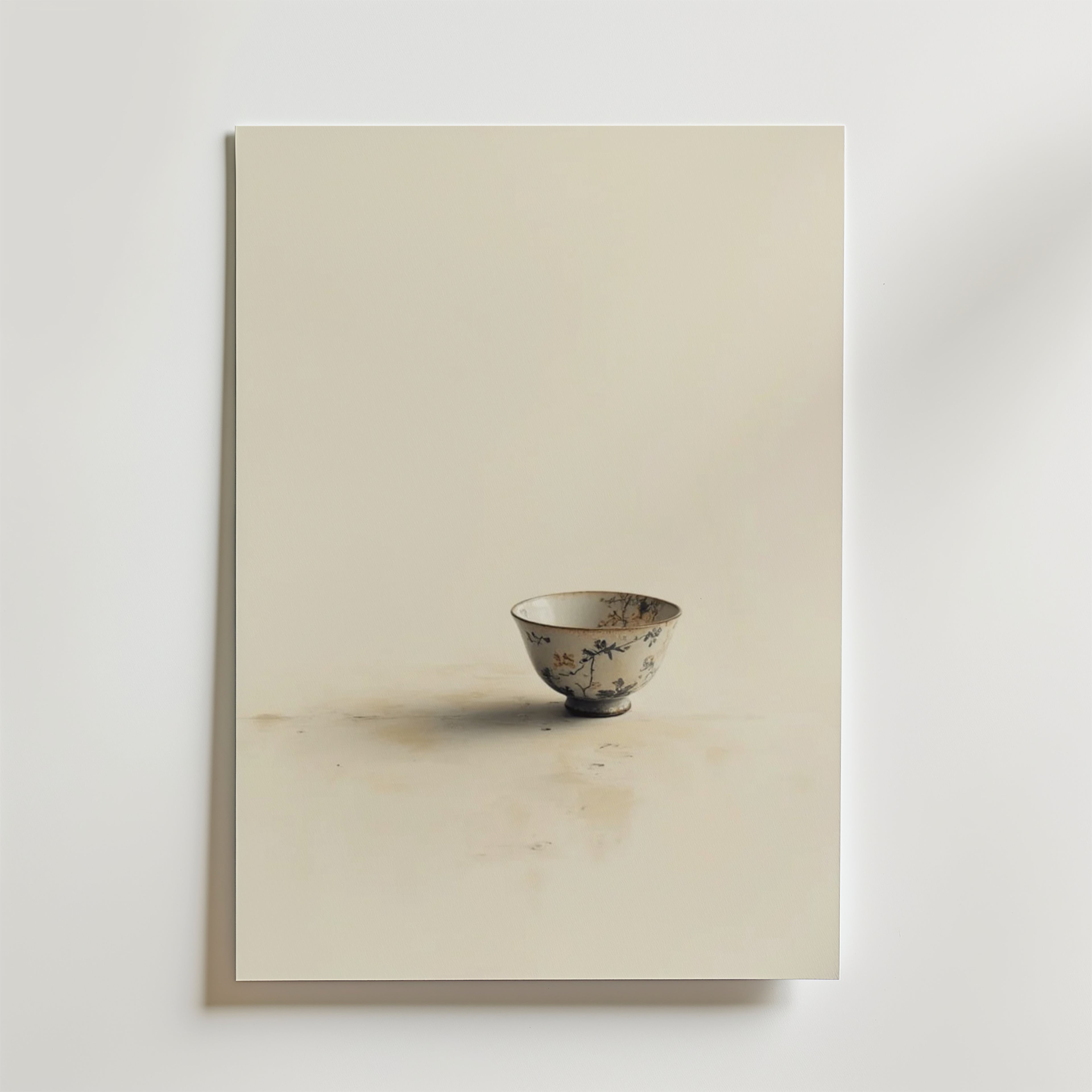 Ett fotografi av en enda utsmyckad porslinsskål med blommönster, placerad på en ljus yta, förkroppsligar minimal elegans - perfekt för hållbar inredning eller som Bozetto Vintage Ceramic Cup Poster på premiumpapper.