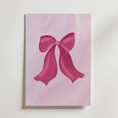 Bozetto Pink Ribbon Charm Poster har en glänsande rosa rosett på en mjuk ljusrosa bakgrund, perfekt som en romantisk poster eller snygg väggdekor mot en vit yta.